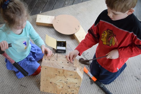 Two Kids with Hammer and Nails